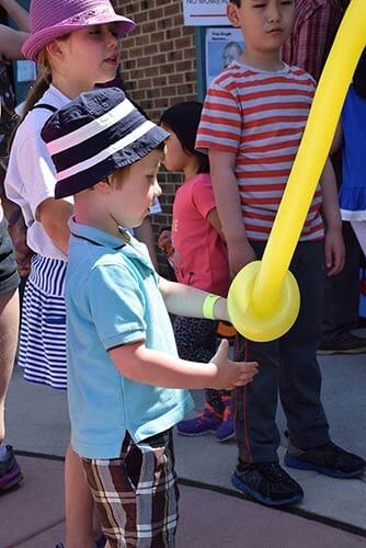 Pravin performing at an elementary school